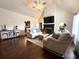 Spacious living room with hardwood floors, fireplace, and vaulted ceiling at 213 Moore Valley Way, Canton, GA 30115