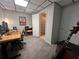 Spacious office features a desk, computer, and a view into an adjacent bathroom with a floral shower curtain at 213 Moore Valley Way, Canton, GA 30115