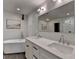 Bathroom boasts a modern double vanity and a large, bright mirror at 260 18Th Nw St # 10203, Atlanta, GA 30363