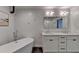 Spa-like bathroom with a freestanding tub and double vanity at 260 18Th Nw St # 10203, Atlanta, GA 30363