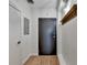 Simple entryway with dark gray door and wood-look flooring at 260 18Th Nw St # 10203, Atlanta, GA 30363