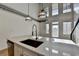 Modern kitchen with island, stainless steel appliances, and white cabinets at 260 18Th Nw St # 10203, Atlanta, GA 30363