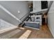 Open concept living area features a modern kitchen and a stylish staircase at 260 18Th Nw St # 10203, Atlanta, GA 30363