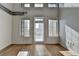 Spacious living area with hardwood floors and access to a balcony at 260 18Th Nw St # 10203, Atlanta, GA 30363
