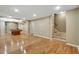 Basement boasting hardwood floors, recessed lighting, a billiards table and a staircase with carpeted steps at 205 Glenbrook Ln, Canton, GA 30115