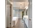 Ensuite bathroom featuring double sink vanity, jacuzzi tub, and walk-in shower at 205 Glenbrook Ln, Canton, GA 30115