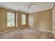 Bedroom with neutral carpet, ceiling fan and two windows letting in plenty of natural light at 205 Glenbrook Ln, Canton, GA 30115
