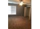 Well-lit bedroom featuring neutral walls and carpet flooring at 205 Glenbrook Ln, Canton, GA 30115