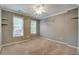 Bedroom with plush carpet, two windows and crown molding at 205 Glenbrook Ln, Canton, GA 30115
