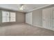 Bedroom featuring plush carpet, window and neutral paint at 205 Glenbrook Ln, Canton, GA 30115