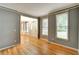 Dining room featuring hardwood floors, neutral wall color, decorative molding and large windows for natural light at 205 Glenbrook Ln, Canton, GA 30115