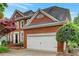 Attractive brick home with a two-car garage, well-maintained landscaping, and a classic architectural design at 205 Glenbrook Ln, Canton, GA 30115