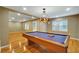 Game room with pool table, hardwood flooring, recessed lighting, and a decorative light fixture at 205 Glenbrook Ln, Canton, GA 30115