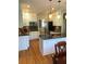 Open kitchen with granite island and hardwood floors at 205 Glenbrook Ln, Canton, GA 30115