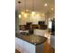 Updated kitchen with white cabinets and granite counters at 205 Glenbrook Ln, Canton, GA 30115