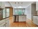 Kitchen featuring a large island with sink, stainless steel dishwasher, and a view into the eating area at 205 Glenbrook Ln, Canton, GA 30115