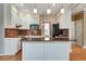 Modern kitchen featuring stainless steel appliances, granite countertops, and custom cabinetry at 205 Glenbrook Ln, Canton, GA 30115