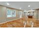 Bright living room with hardwood floors, large window and pool table at 205 Glenbrook Ln, Canton, GA 30115