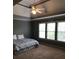Spacious main bedroom with high ceilings, ceiling fan, and ample natural light at 205 Glenbrook Ln, Canton, GA 30115