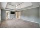 Spacious bedroom featuring plush carpet, ceiling fan, and ensuite bathroom access at 205 Glenbrook Ln, Canton, GA 30115
