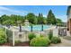 Beautiful community pool area featuring a large pool, lounge chairs, and umbrellas for relaxation and recreation at 205 Glenbrook Ln, Canton, GA 30115
