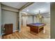 Basement with a pool table, recessed lighting, hardwood floors and a bar area perfect for entertaining at 205 Glenbrook Ln, Canton, GA 30115