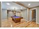 Finished basement area with modern lighting, sleek flooring, billiards table for entertaining guests at 205 Glenbrook Ln, Canton, GA 30115