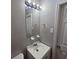 Clean bathroom with vanity, mirror, and light fixture at 3445 Mell Pl, Clarkston, GA 30021