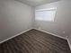 Bright bedroom with wood-look floors and neutral walls at 3445 Mell Pl, Clarkston, GA 30021