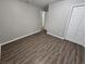 Bright bedroom with wood-look floors and neutral walls at 3445 Mell Pl, Clarkston, GA 30021
