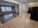 Open concept kitchen and dining area with tile floors at 3445 Mell Pl, Clarkston, GA 30021