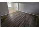 Living room with grey walls and wood-look floors at 3445 Mell Pl, Clarkston, GA 30021