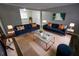 Spacious living room with two navy sofas, coffee table, and stylish decor at 3445 Mell Pl, Clarkston, GA 30021
