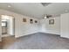 Spacious bonus room with grey carpet and ceiling fan at 6710 Country Lake Rd, Cumming, GA 30041