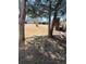 Sunny backyard with trees and a grassy area at 2479 Kingsland Dr, Dunwoody, GA 30360