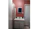 Bathroom with updated vanity and coral walls at 2479 Kingsland Dr, Dunwoody, GA 30360