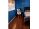 Bedroom with hardwood floors and a built-in workspace at 2479 Kingsland Dr, Dunwoody, GA 30360