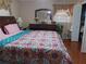 Large bedroom with a king-size bed and hardwood floors at 2479 Kingsland Dr, Dunwoody, GA 30360