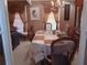 Bright dining room with a large table, chairs, and a hutch at 2479 Kingsland Dr, Dunwoody, GA 30360
