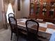 Formal dining room with a large table, chairs, and a hutch at 2479 Kingsland Dr, Dunwoody, GA 30360