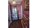 Entryway with decorative cabinet, console table, and pink walls at 2479 Kingsland Dr, Dunwoody, GA 30360