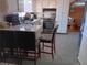 Eat-in kitchen with granite countertops and grey tile floors at 2479 Kingsland Dr, Dunwoody, GA 30360