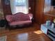Living room with antique sofa and hardwood floors at 2479 Kingsland Dr, Dunwoody, GA 30360