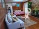 Spacious living room with hardwood floors, comfy sofas, and a cozy fireplace at 2479 Kingsland Dr, Dunwoody, GA 30360