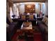 Bright living room with two sofas, a coffee table, and a view into the dining room at 2479 Kingsland Dr, Dunwoody, GA 30360