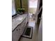 Well-lit bathroom featuring speckled granite countertop, patterned tile flooring, and updated fixtures at 2479 Kingsland Dr, Dunwoody, GA 30360