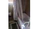 Clean bathroom with a white shower curtain, white bathtub, and neutral wall tiles at 2479 Kingsland Dr, Dunwoody, GA 30360
