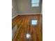 Bright bedroom with hardwood floors and natural light from two windows at 2479 Kingsland Dr, Dunwoody, GA 30360