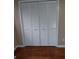 Bi-fold doors on a closet with hardwood floors at 2479 Kingsland Dr, Dunwoody, GA 30360