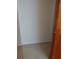 A small closet with carpeted floor and a white wall at 2479 Kingsland Dr, Dunwoody, GA 30360